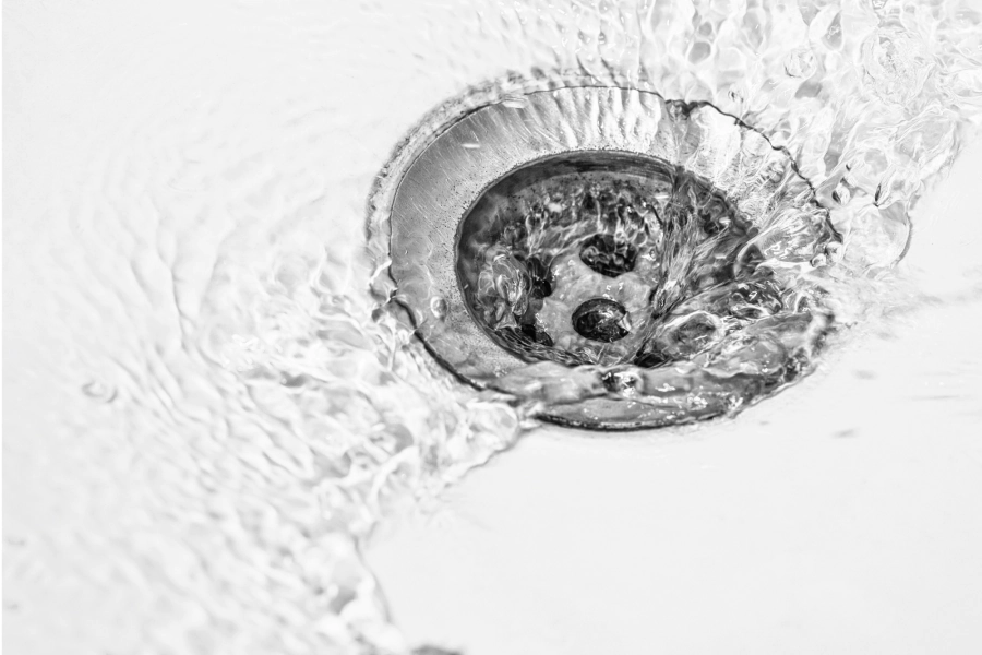 platinum drain of a white kitchen sink